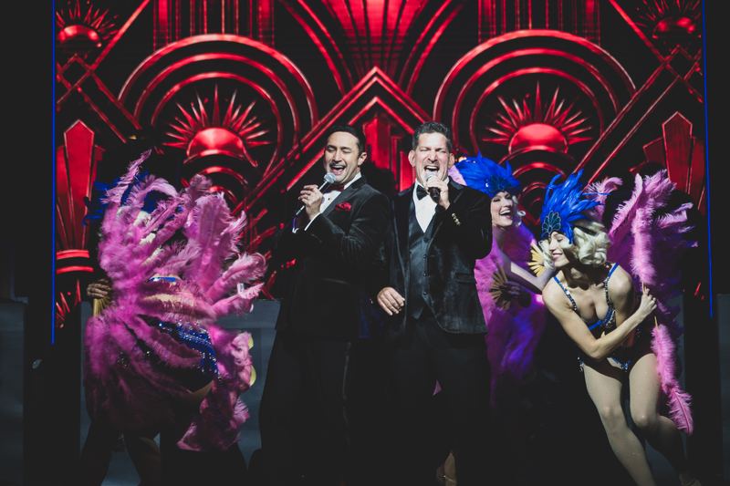 The showgirls flank the crooners
